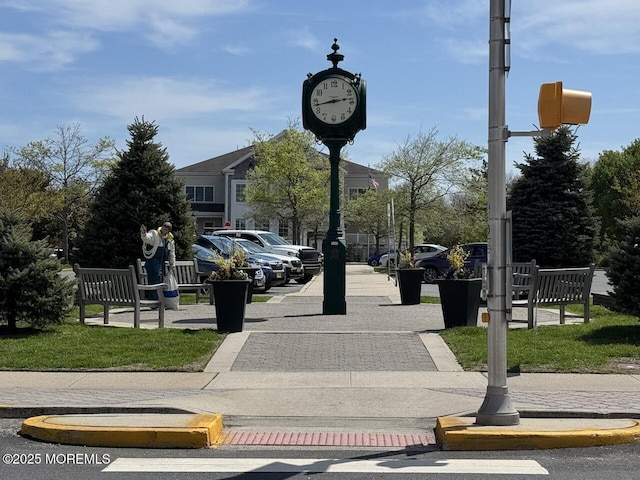 view of property's community with uncovered parking