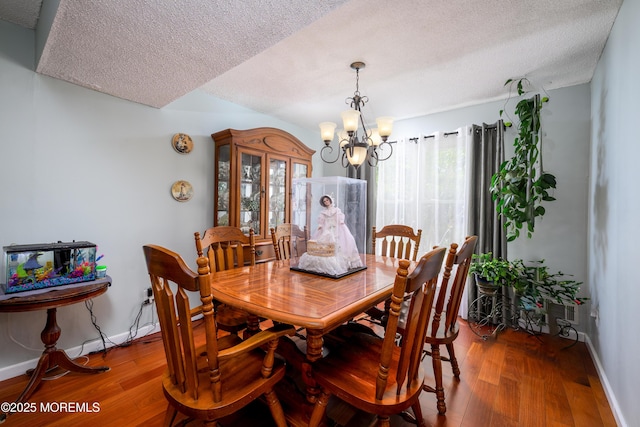102 Buckingham Dr, Jackson, NJ 08527 - dining area featuring a textured ceiling, wood-type flooring, a chandelier, and baseboards