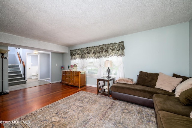102 Buckingham Dr, Jackson, NJ 08527 - living room with stairs, dark wood-type flooring, baseboards, and a textured ceiling