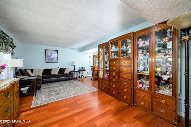 102 Buckingham Dr, Jackson, NJ 08527 - living room featuring a textured ceiling and wood finished floors