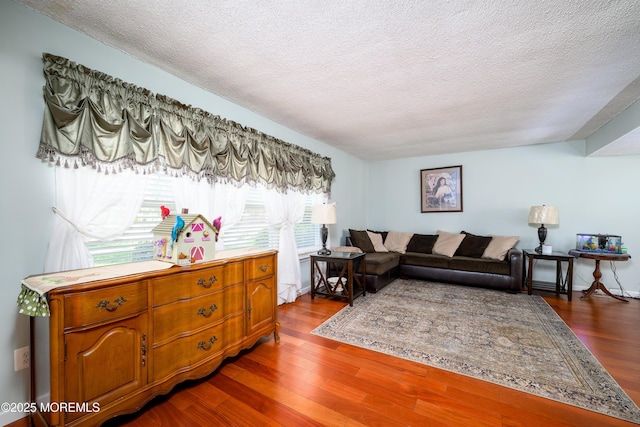 102 Buckingham Dr, Jackson, NJ 08527 - living area featuring a textured ceiling and dark wood-style floors