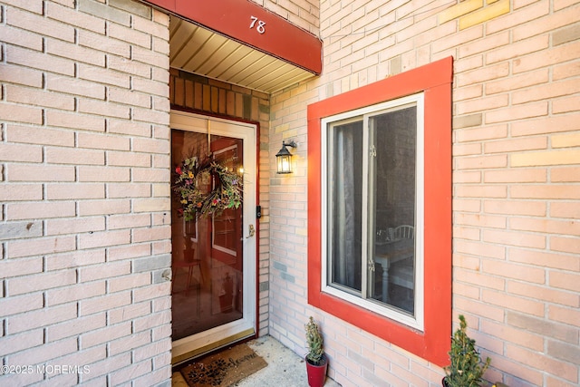 entrance to property with brick siding