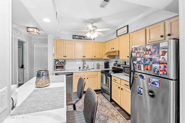 kitchen with a sink, light brown cabinets, stainless steel appliances, and visible vents