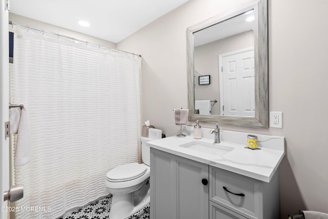 full bathroom with vanity and toilet