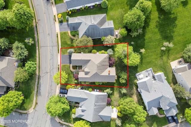 aerial perspective of suburban area featuring property boundaries highlighted