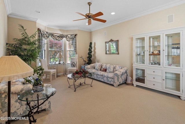 carpeted living area featuring ceiling fan, ornamental molding, and recessed lighting