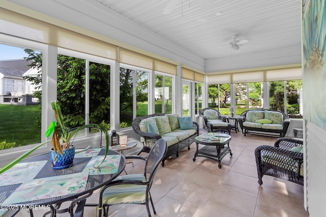 sunroom with ceiling fan, an outdoor hangout area, and outdoor dining area