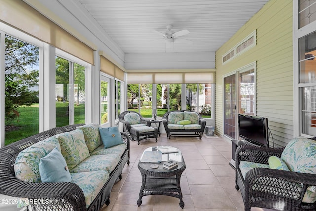 sunroom with outdoor lounge area and ceiling fan
