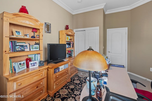 carpeted home office featuring ornamental molding and baseboards