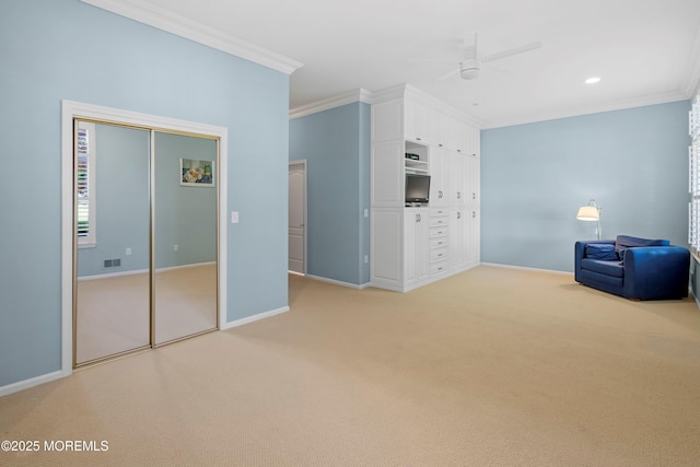 unfurnished bedroom featuring crown molding, light colored carpet, baseboards, ceiling fan, and recessed lighting