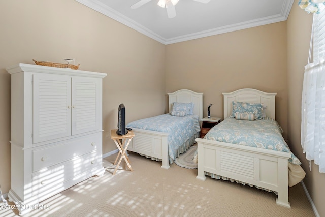 carpeted bedroom with ornamental molding, baseboards, and a ceiling fan