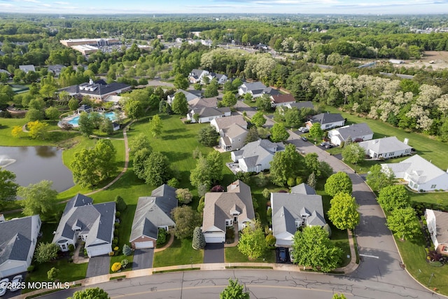 aerial perspective of suburban area featuring a nearby body of water