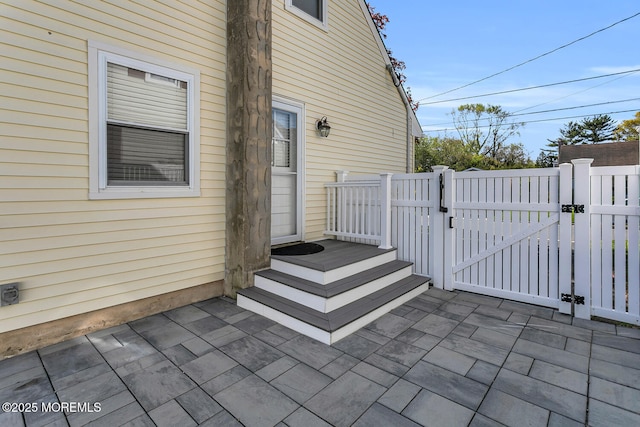 view of patio / terrace with a gate and fence