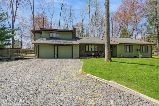 213 Dey Grove Rd, Monroe, NJ 08831 - view of front of property featuring driveway, a chimney, a front yard, and a garage
