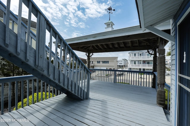 wooden terrace featuring stairway