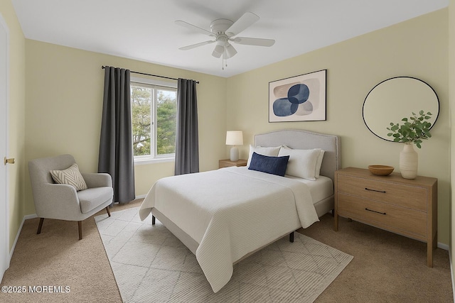 bedroom featuring baseboards, ceiling fan, and light carpet