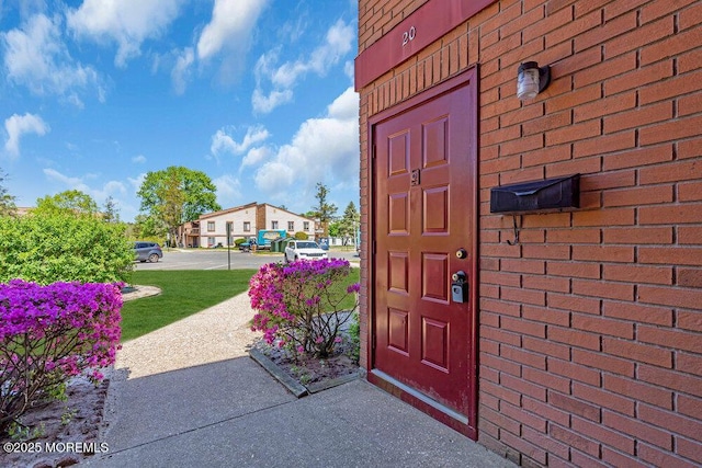 entrance to property with brick siding
