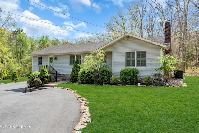 86 Cox Cro Rd, Toms River, NJ 08755 - single story home featuring a shingled roof, a front lawn, central AC, and a chimney