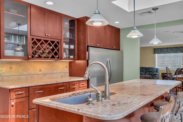 86 Cox Cro Rd, Toms River, NJ 08755 - kitchen with visible vents, pendant lighting, a sink, light stone counters, and freestanding refrigerator