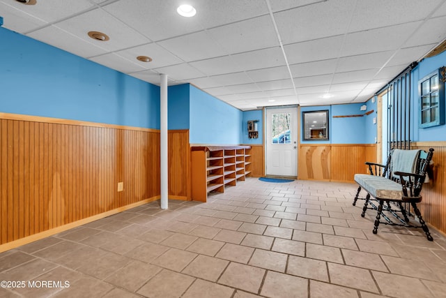 86 Cox Cro Rd, Toms River, NJ 08755 - unfurnished room featuring a wainscoted wall, tile patterned floors, a drop ceiling, and wood walls