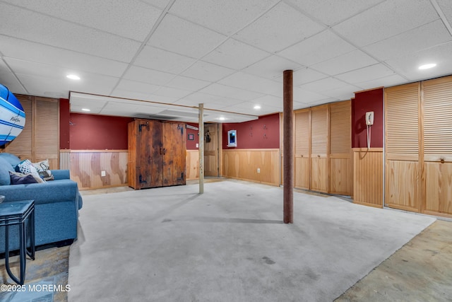 86 Cox Cro Rd, Toms River, NJ 08755 - finished below grade area with a paneled ceiling, a wainscoted wall, and wooden walls