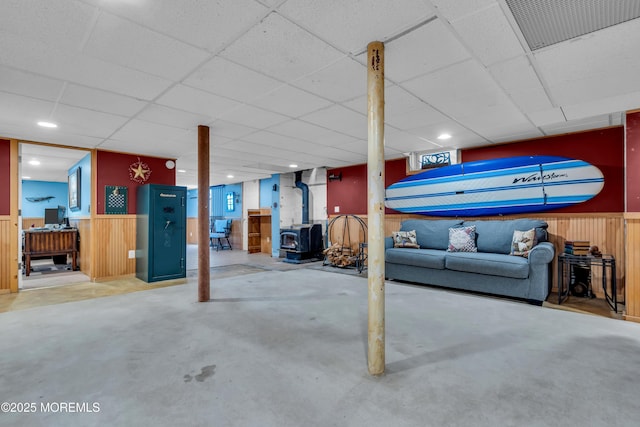 86 Cox Cro Rd, Toms River, NJ 08755 - finished basement with visible vents, wainscoting, a drop ceiling, and a wood stove