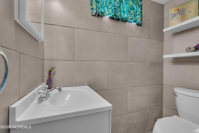 86 Cox Cro Rd, Toms River, NJ 08755 - half bathroom featuring toilet, tile walls, and vanity
