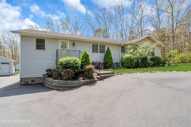 86 Cox Cro Rd, Toms River, NJ 08755 - single story home featuring a garage, a front lawn, aphalt driveway, and an outbuilding