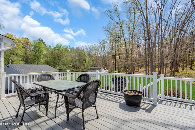 86 Cox Cro Rd, Toms River, NJ 08755 - wooden terrace with outdoor dining area and an outbuilding
