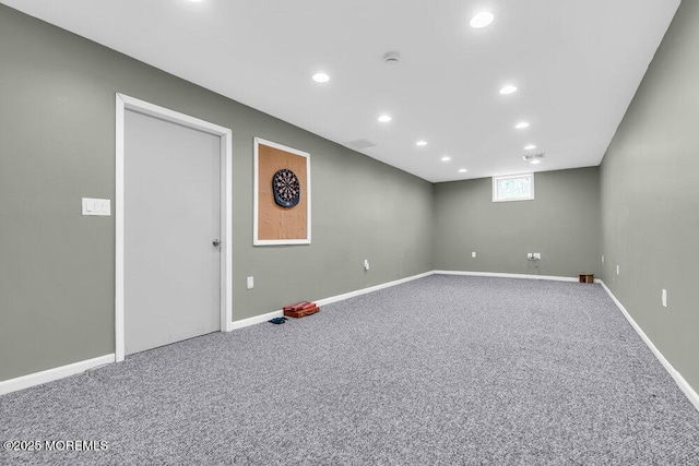 below grade area featuring recessed lighting, baseboards, and carpet