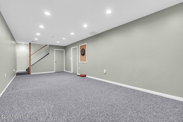 finished basement with recessed lighting, stairs, carpet, and baseboards