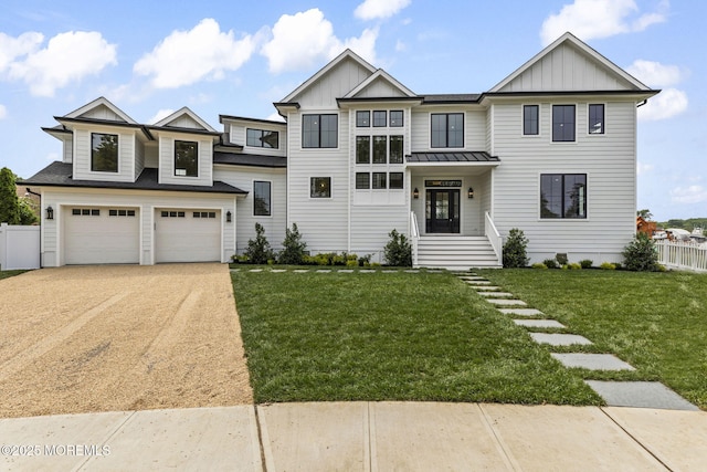 24 Baruch Dr, Long Branch, NJ 07740 - view of front of property with board and batten siding, concrete driveway, a garage, a standing seam roof, and a metal roof