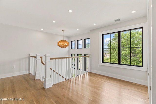 24 Baruch Dr, Long Branch, NJ 07740 - corridor with an upstairs landing, a chandelier, light wood-style floors, and recessed lighting