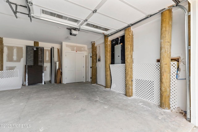 24 Baruch Dr, Long Branch, NJ 07740 - garage featuring electric panel and a garage door opener