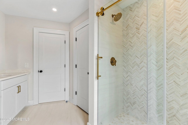 24 Baruch Dr, Long Branch, NJ 07740 - full bath with a shower stall, vanity, wood finished floors, and recessed lighting