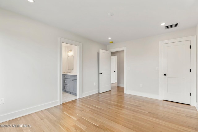 24 Baruch Dr, Long Branch, NJ 07740 - unfurnished bedroom with light wood-type flooring, recessed lighting, and ensuite bathroom