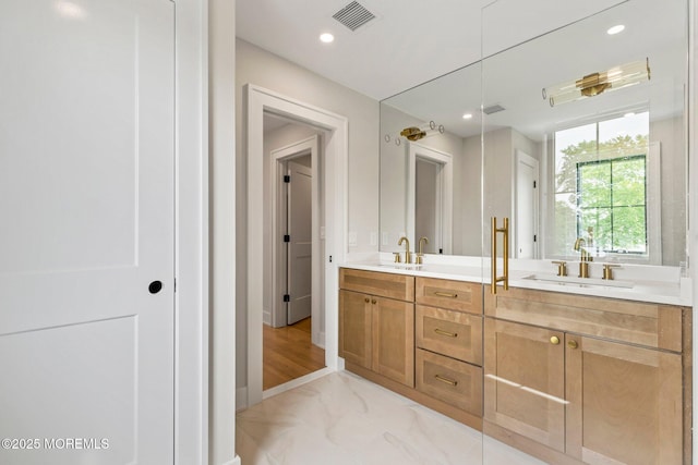 24 Baruch Dr, Long Branch, NJ 07740 - bathroom featuring double vanity, marble look tiles, and recessed lighting