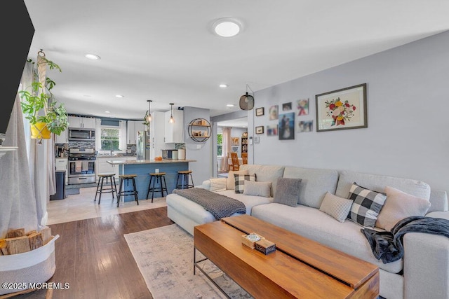 living area featuring recessed lighting and wood finished floors