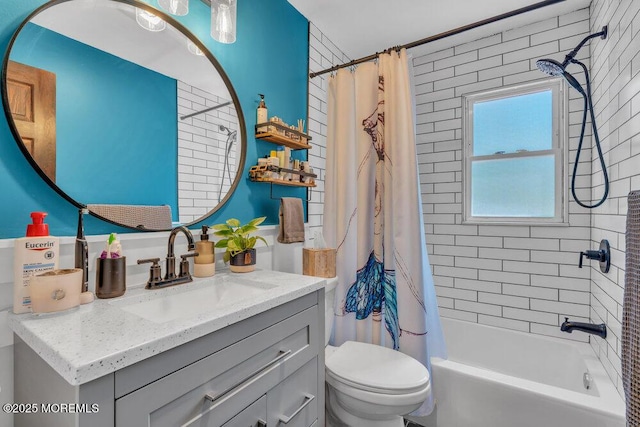 full bath featuring vanity, shower / bath combo, and toilet