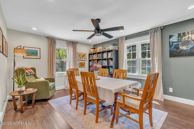 dining room featuring a ceiling fan, baseboards, recessed lighting, and wood finished floors