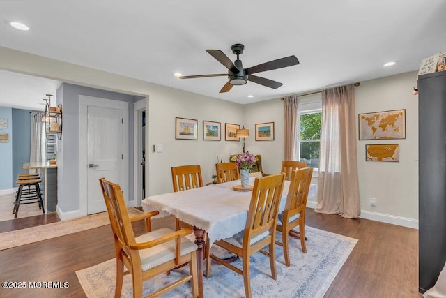 dining room featuring baseboards, a ceiling fan, recessed lighting, and dark wood-type flooring