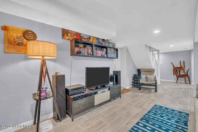 living room with recessed lighting, baseboards, and wood tiled floor