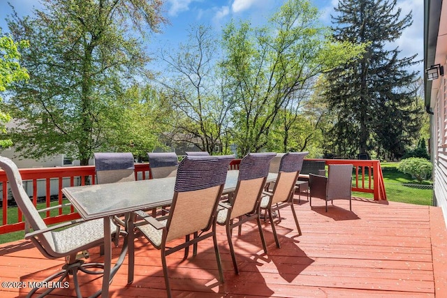deck with outdoor dining area
