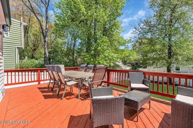 wooden deck with outdoor dining space