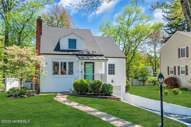 view of front of property featuring a garage, fence, a front yard, a chimney, and a shingled roof