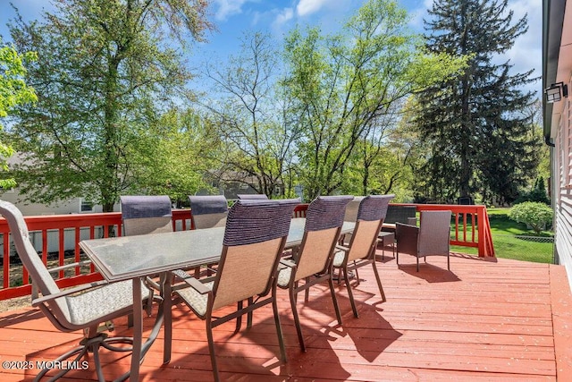 wooden terrace featuring outdoor dining space