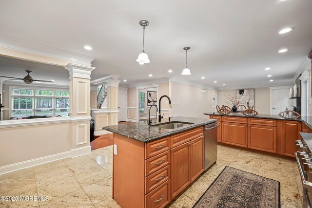kitchen with a sink, crown molding, decorative columns, brown cabinets, and recessed lighting