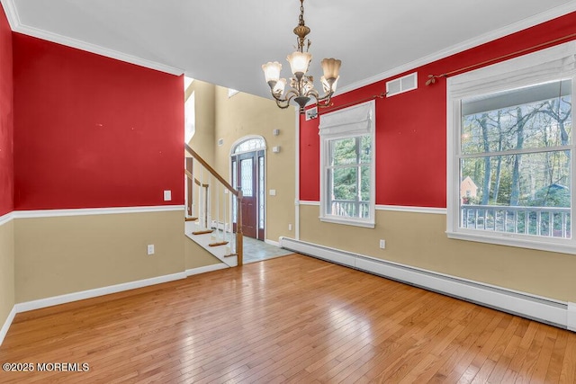 65 Pineoaka Rd, Jackson, NJ 08527 - interior space with wood-type flooring, a chandelier, stairs, a baseboard heating unit, and visible vents