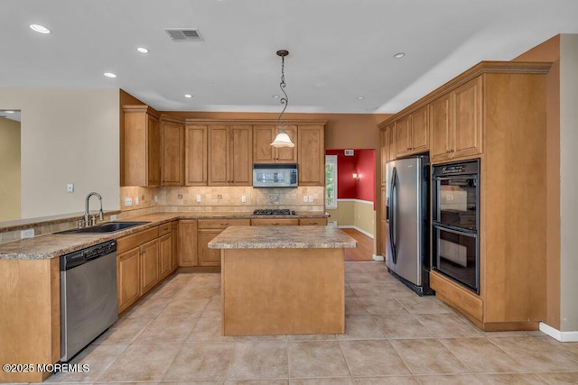 65 Pineoaka Rd, Jackson, NJ 08527 - kitchen with visible vents, a kitchen island, light countertops, a sink, and appliances with stainless steel finishes