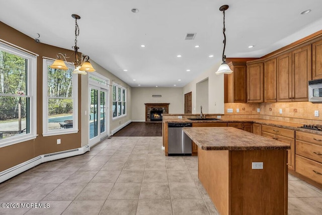 65 Pineoaka Rd, Jackson, NJ 08527 - kitchen with a kitchen island, visible vents, baseboard heating, stainless steel dishwasher, and black stovetop